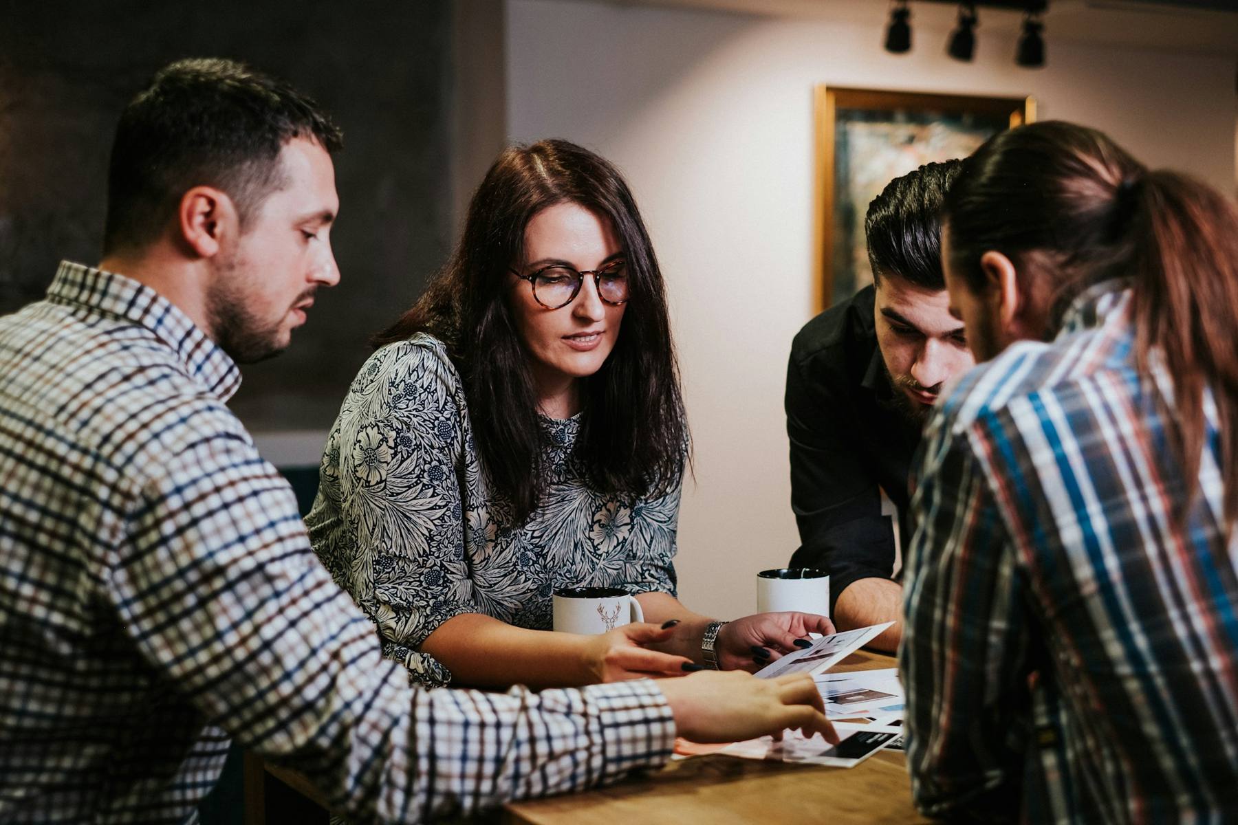 A small ministry team reviewing documents together at a table
